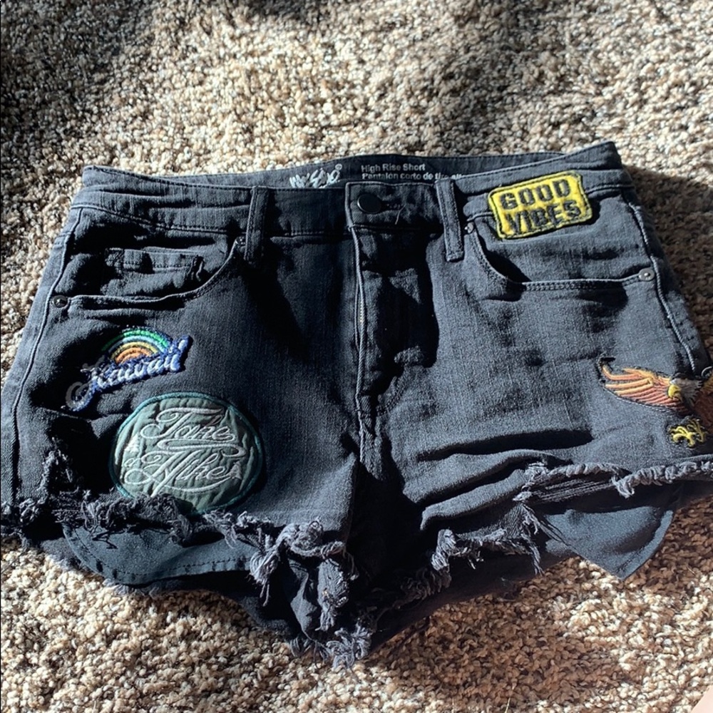 “Destroyed” black denim shorts